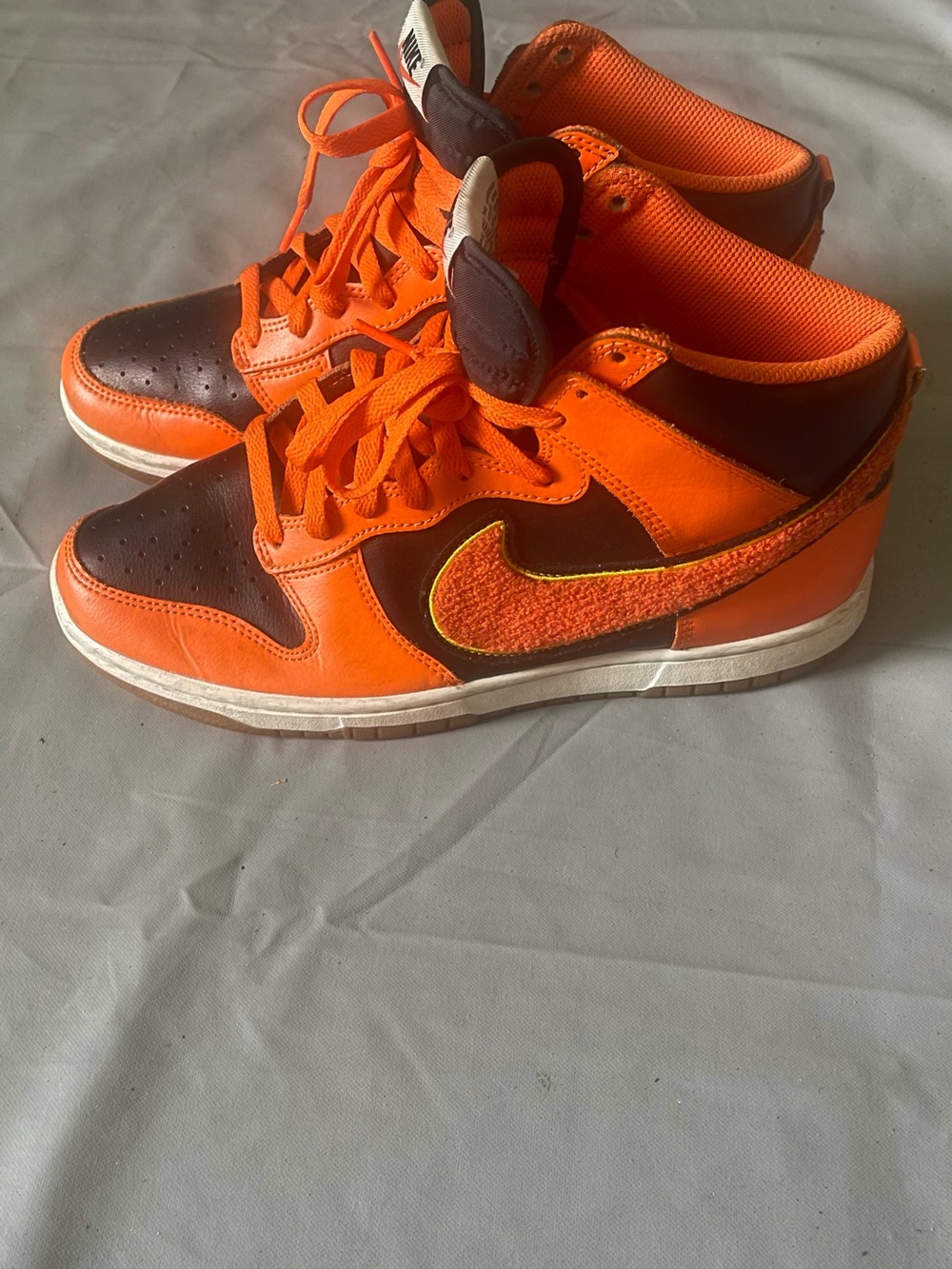 Nike Orange and Brown High-Top Sneakers with Textured Swoosh